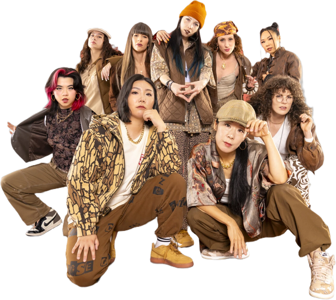 Diamonds Crew dancers posed in a tight group on a terracotta studio backdrop