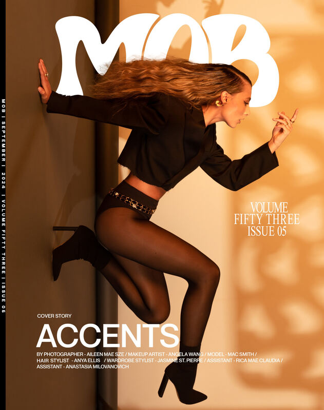 Mob Journal Volume 53 cover: a model in black mid-leap against a warm wall, headline Accents