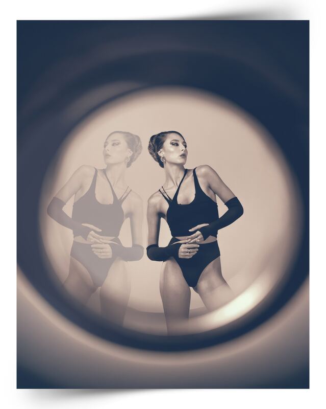 Two models framed through a circular light modifier, published in iMirage Magazine