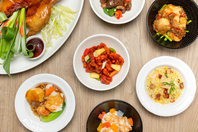 Overhead view of Chinese dishes at Shang Palace, Shangri-La